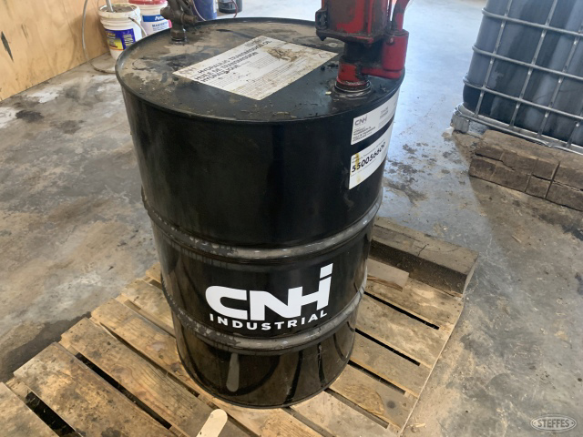 20 gal +/- of CNH hyd oil in steel drum with pump